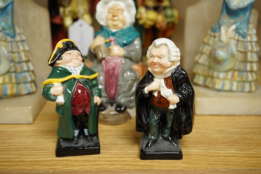 Two Royal Doulton figures comprising; The Mask Seller and Pied Piper together with three other figures and a pair of alabaster bookends, largest 24cm high. Condition - mostly fair/good